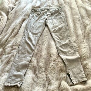 Light, gray, stretchy, small, zipper, bottom Levi’s. Just above hip height.